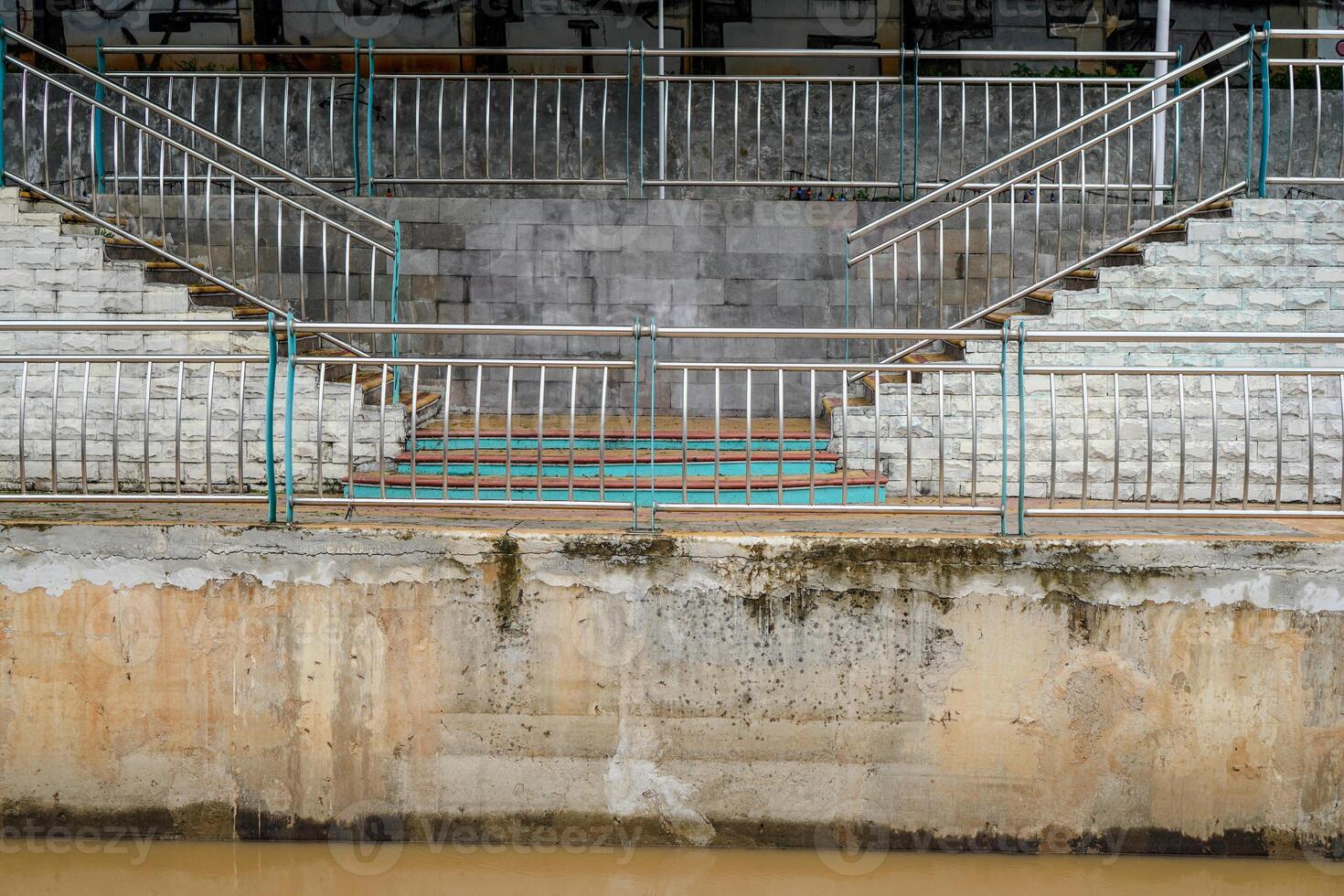 looking far from the garden steps with the river's brick fence. photo