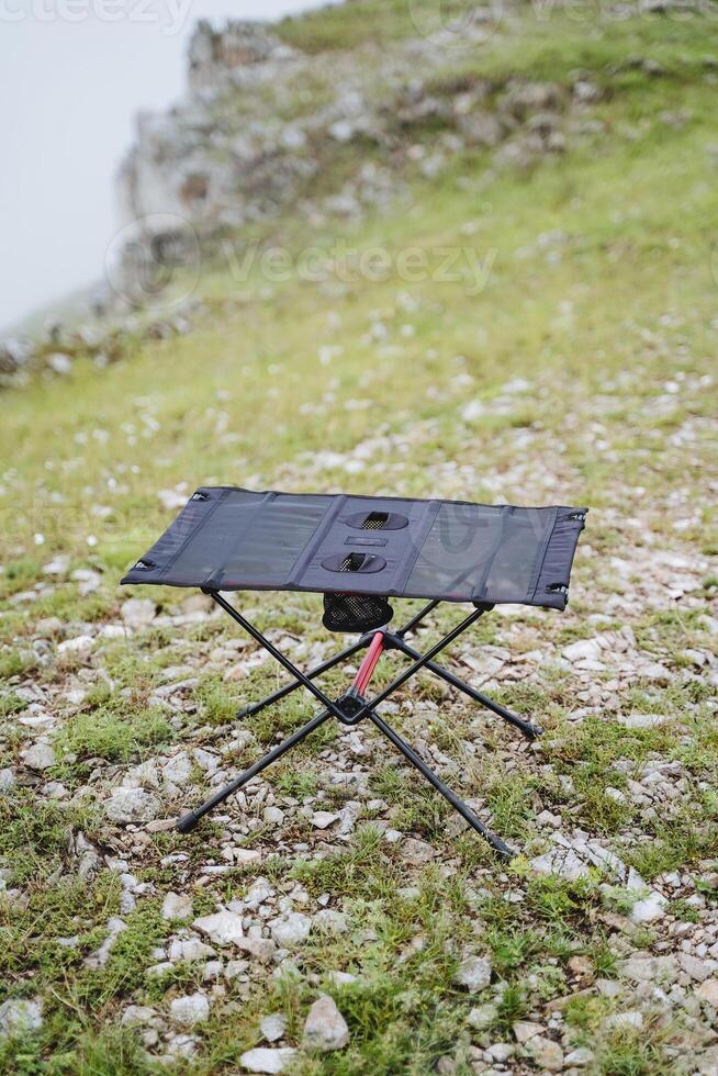 Top view compact camping table, frame table for picnic in nature photo