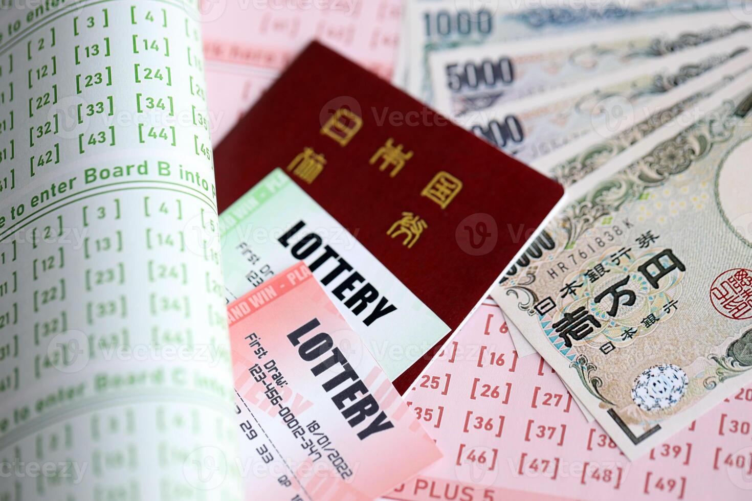 Lottery tickets lies with japanese yen bills on gambling sheets with numbers for marking to play lottery photo