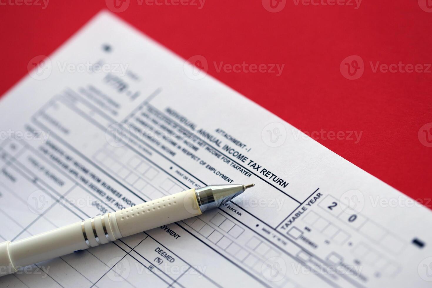 Indonesian tax form 1770-1 Individual Income Tax Return and pen on table photo