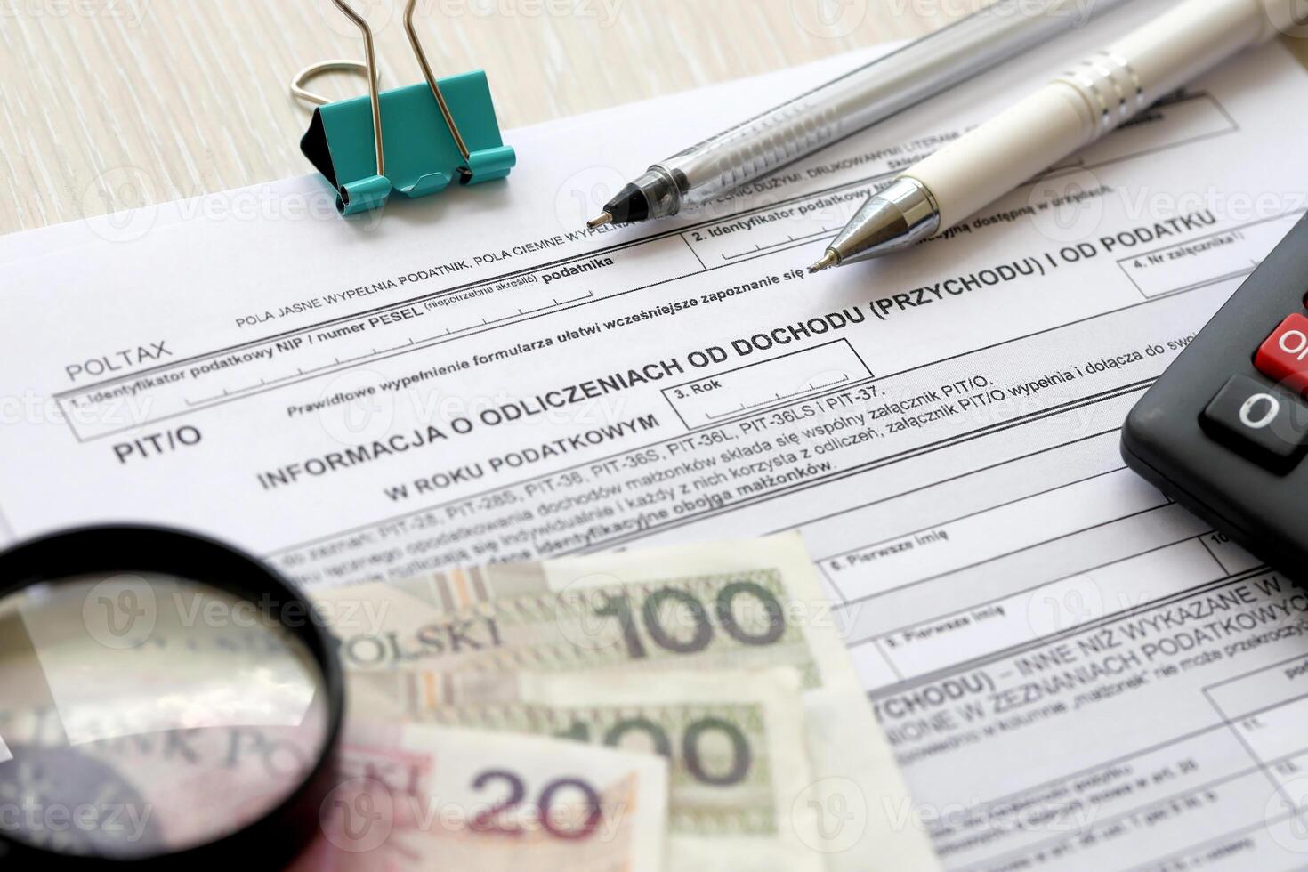 Information about deductions from income and tax, PIT-O form on accountant table with pen and polish zloty money bills photo