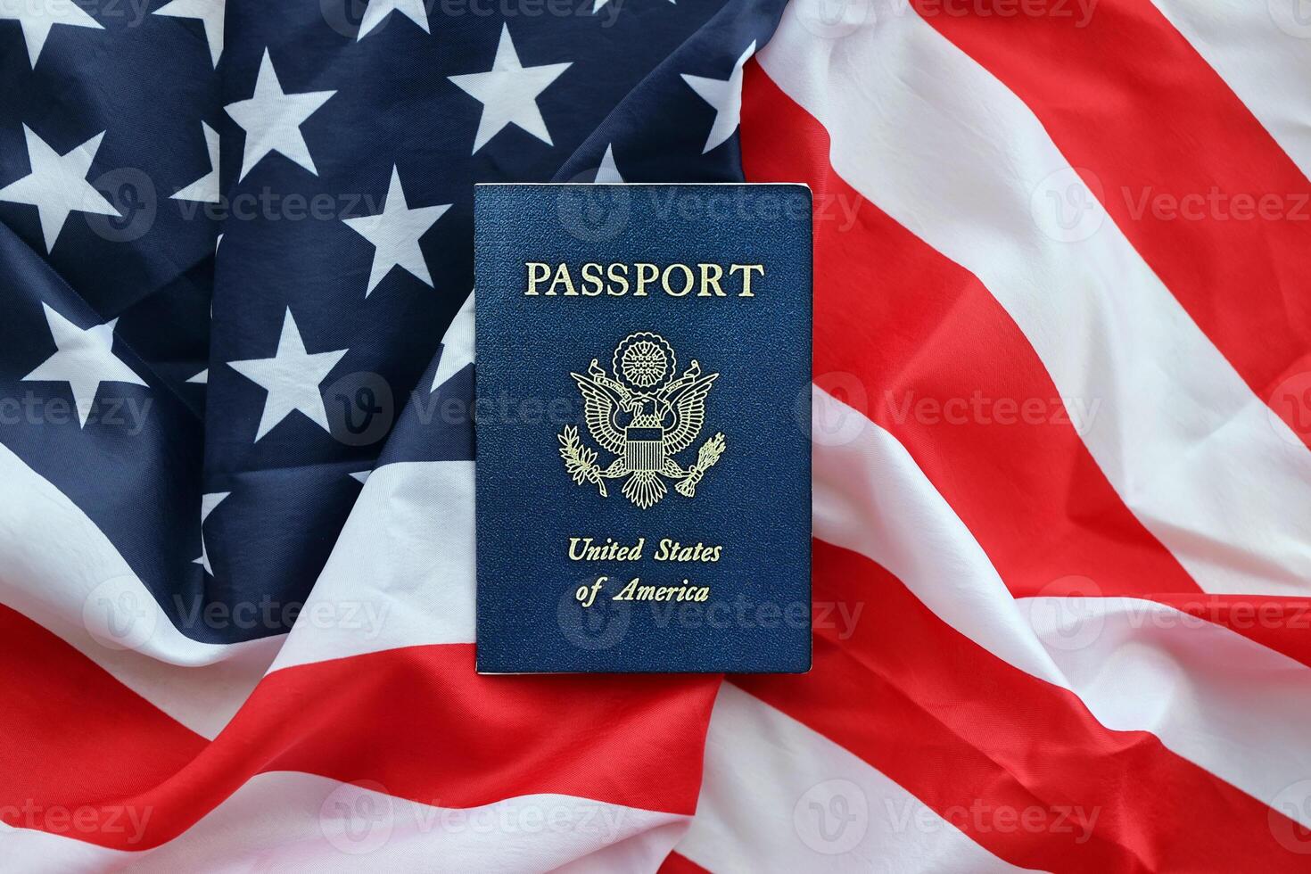 Blue United States of America passport on national flag background close up photo