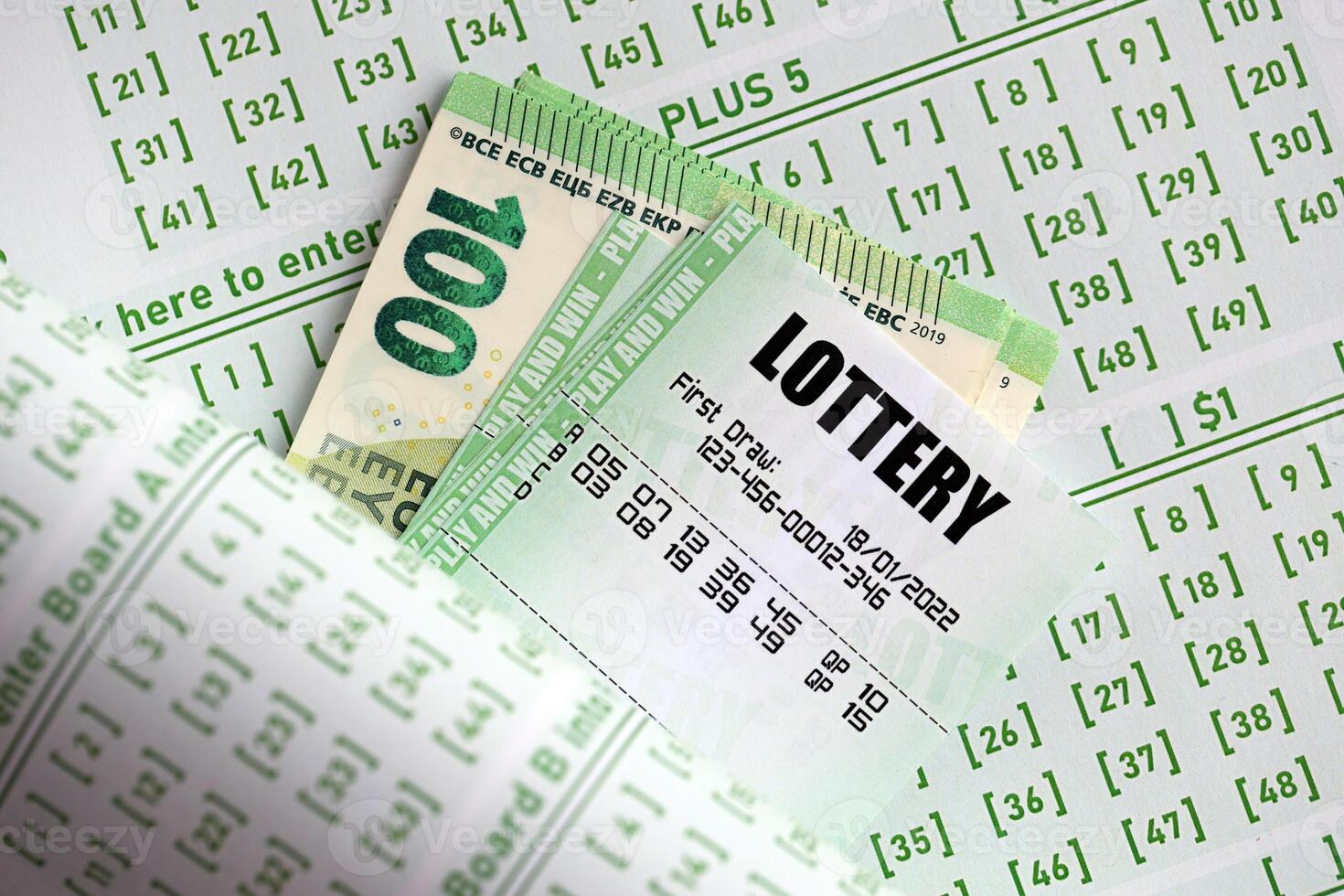 Green lottery tickets and euro money bills on blank with numbers for playing lottery photo