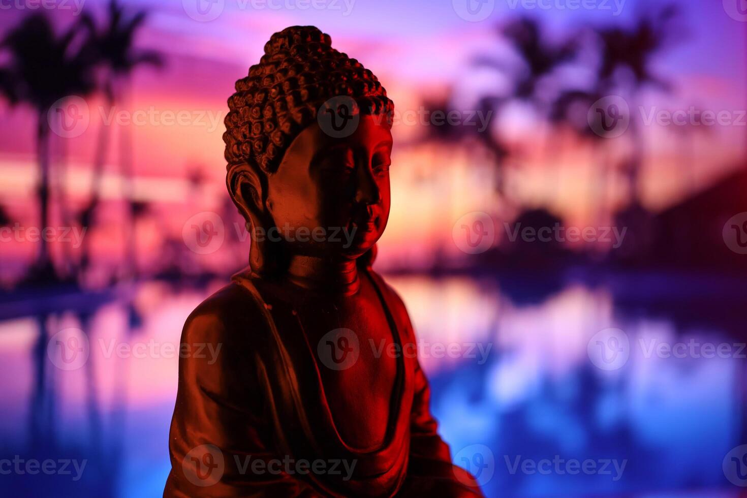 Buddha Purnima and Vesak day concept, Buddha statue with low key light against beautiful and colorful background. Meditation photo