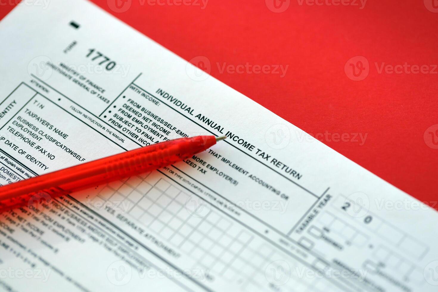 Indonesian tax form 1770 Individual Income Tax Return and pen on table photo
