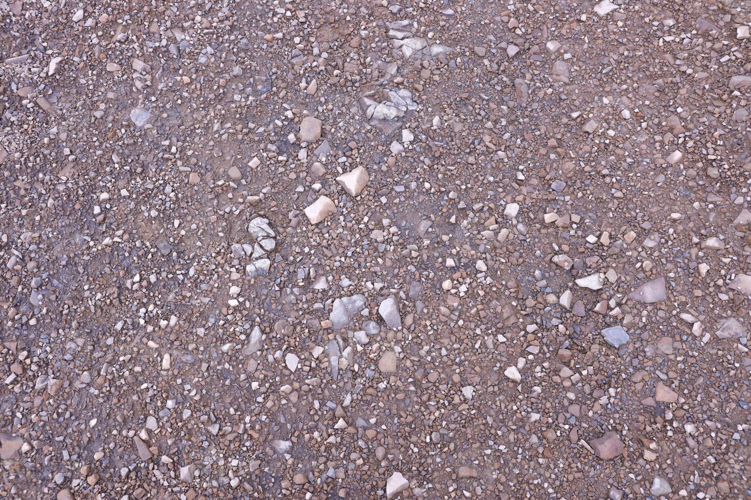 Background of shattered stony stones surface in mountain area. Texture with natural light photo