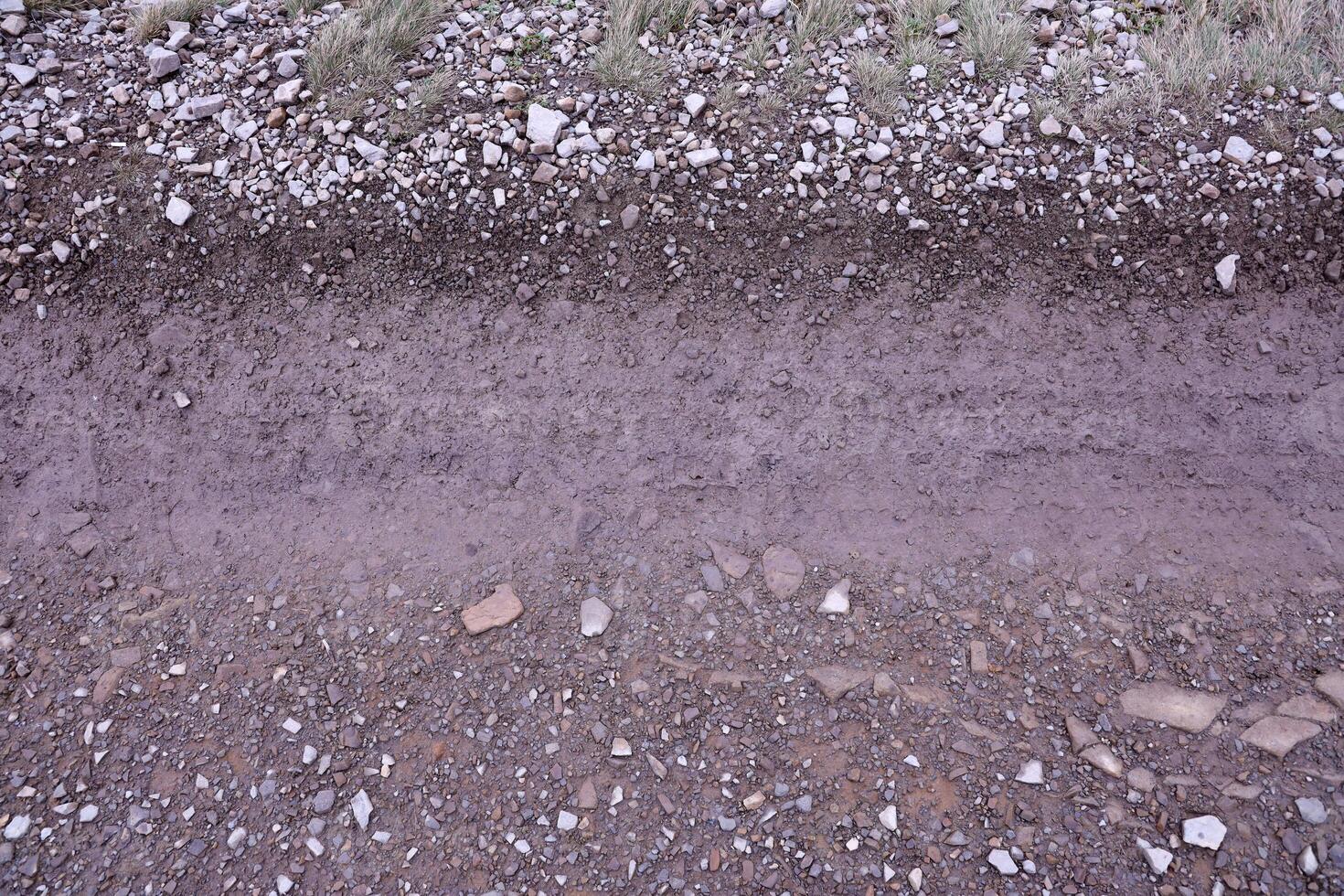 Background of shattered stony stones surface in mountain area. Texture with natural light photo