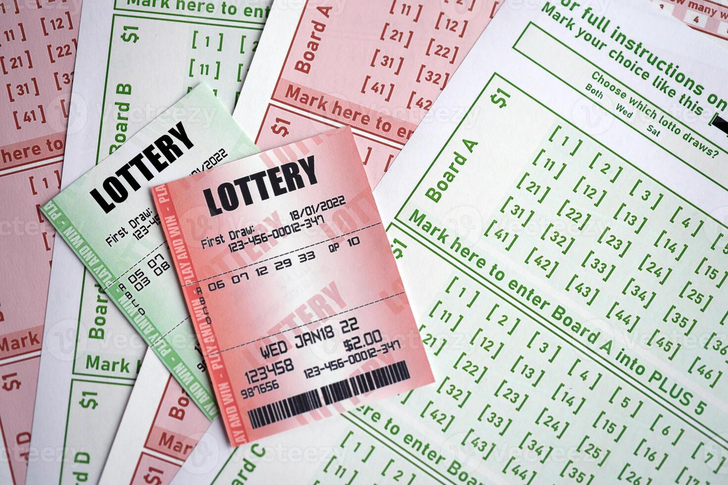 Green and red lottery tickets on blank bills with numbers for playing lottery photo