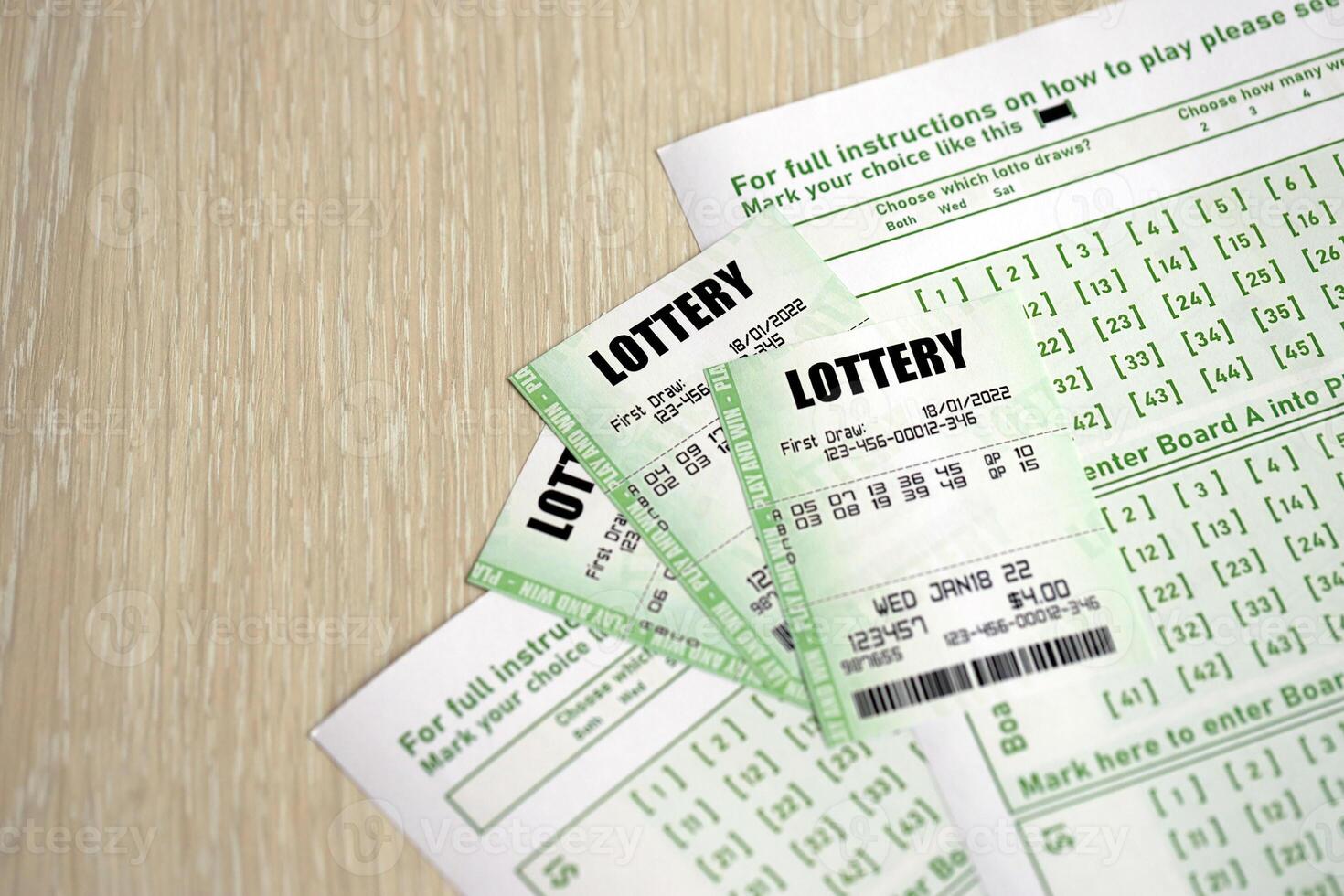 Green lottery tickets and blank bills with numbers for playing lottery photo