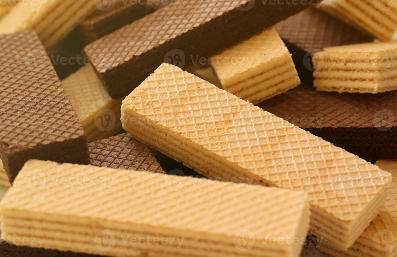 Stacked delicious chocolate wafers in large amount. Two different flavours of classic waffles photo