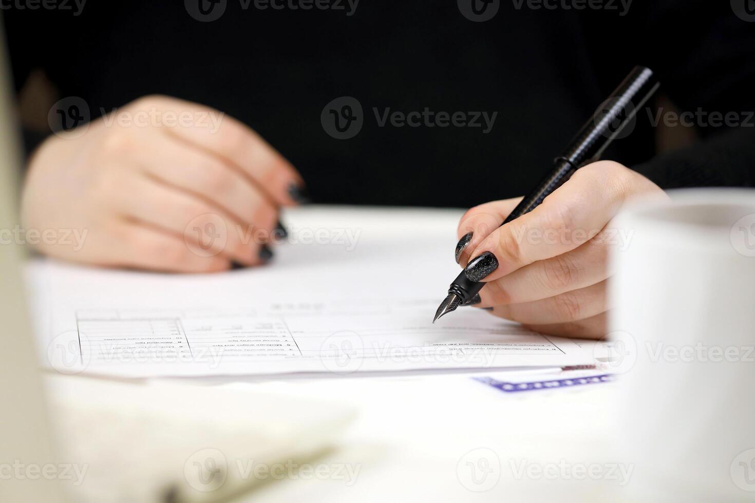 Accountant fill American tax form W-2 Wage and Tax Statement in end of tax period. Taxation and paperwork routine photo