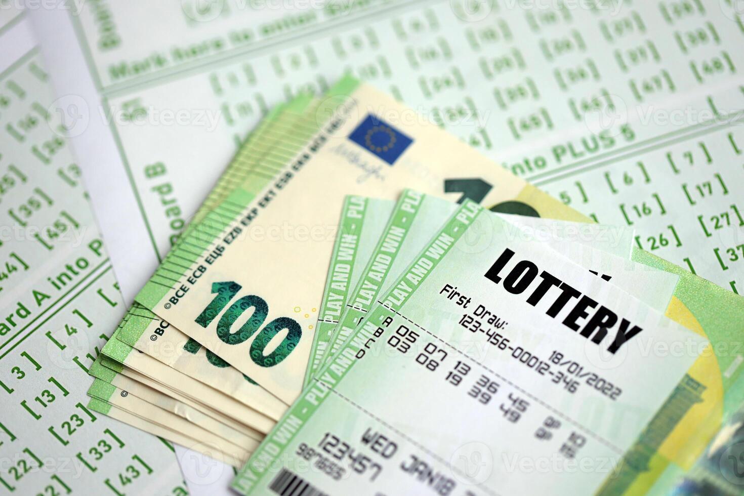 Green lottery tickets and euro money bills on blank with numbers for playing lottery photo