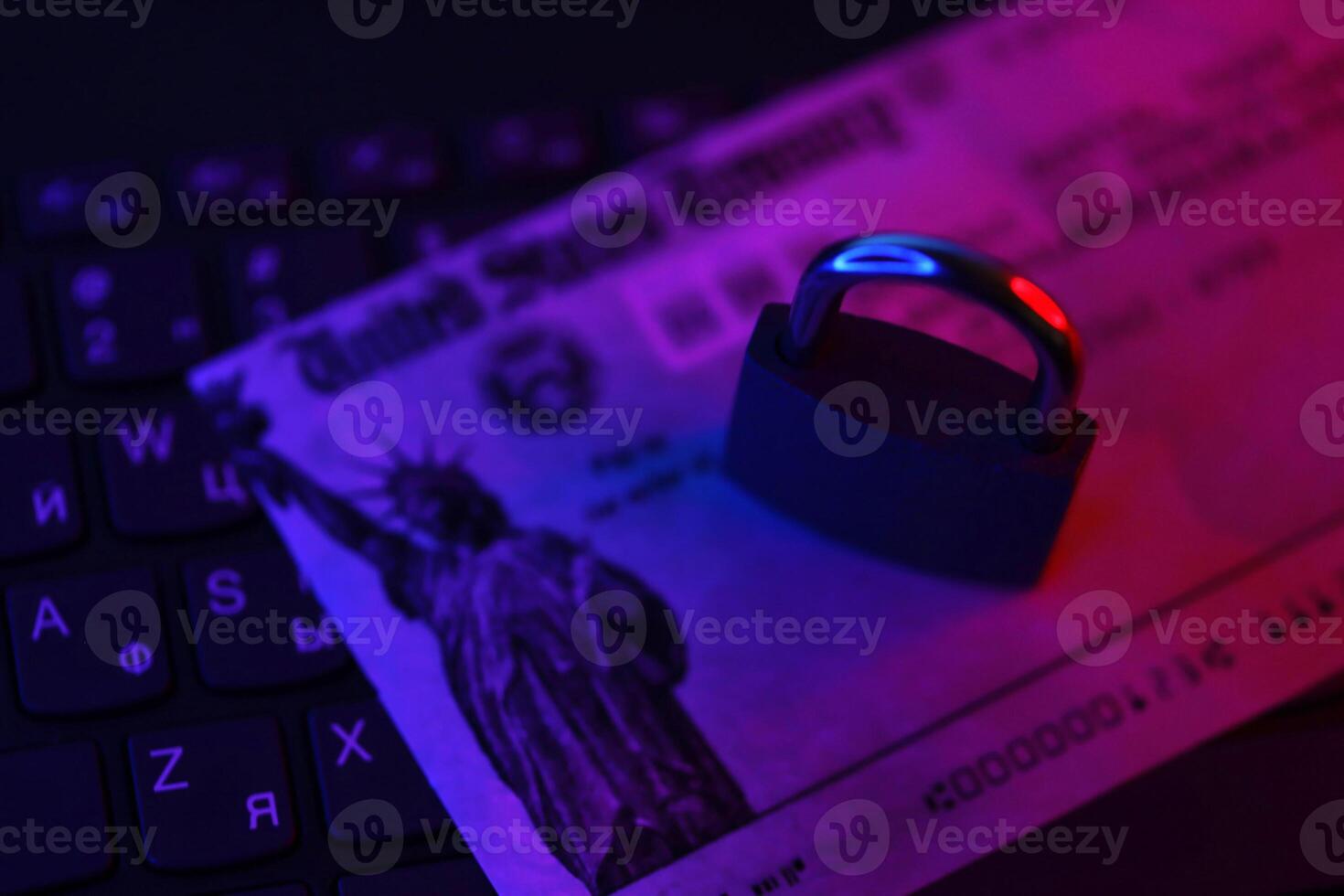 United States Treasury refund check or stimulus bill with small padlock on computer keyboard photo