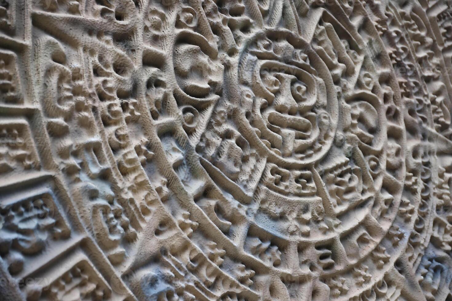 Ancient Mayan Calendar or Aztec calendar with rough relief surface photo