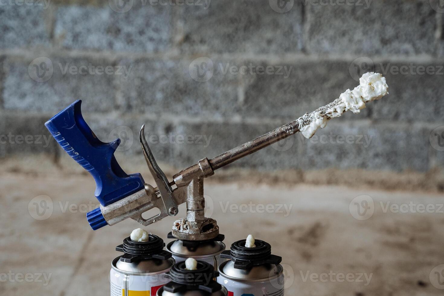 Spray foam gun, construction tool for indoor work, insulate windows, spray foam. photo