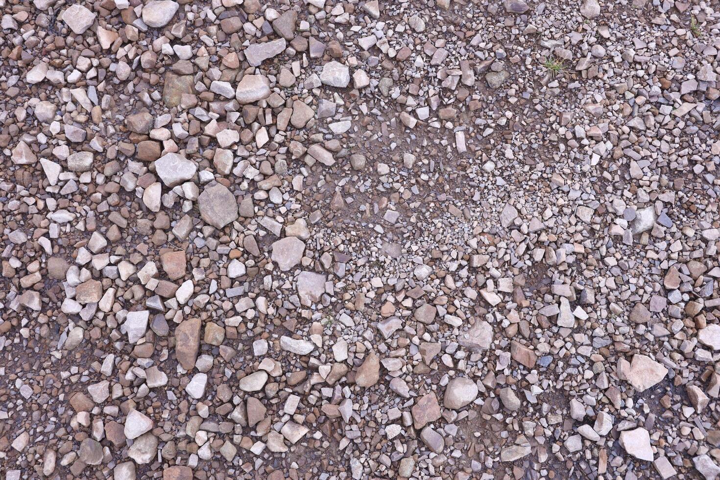 Background of shattered stony stones surface in mountain area. Texture with natural light photo