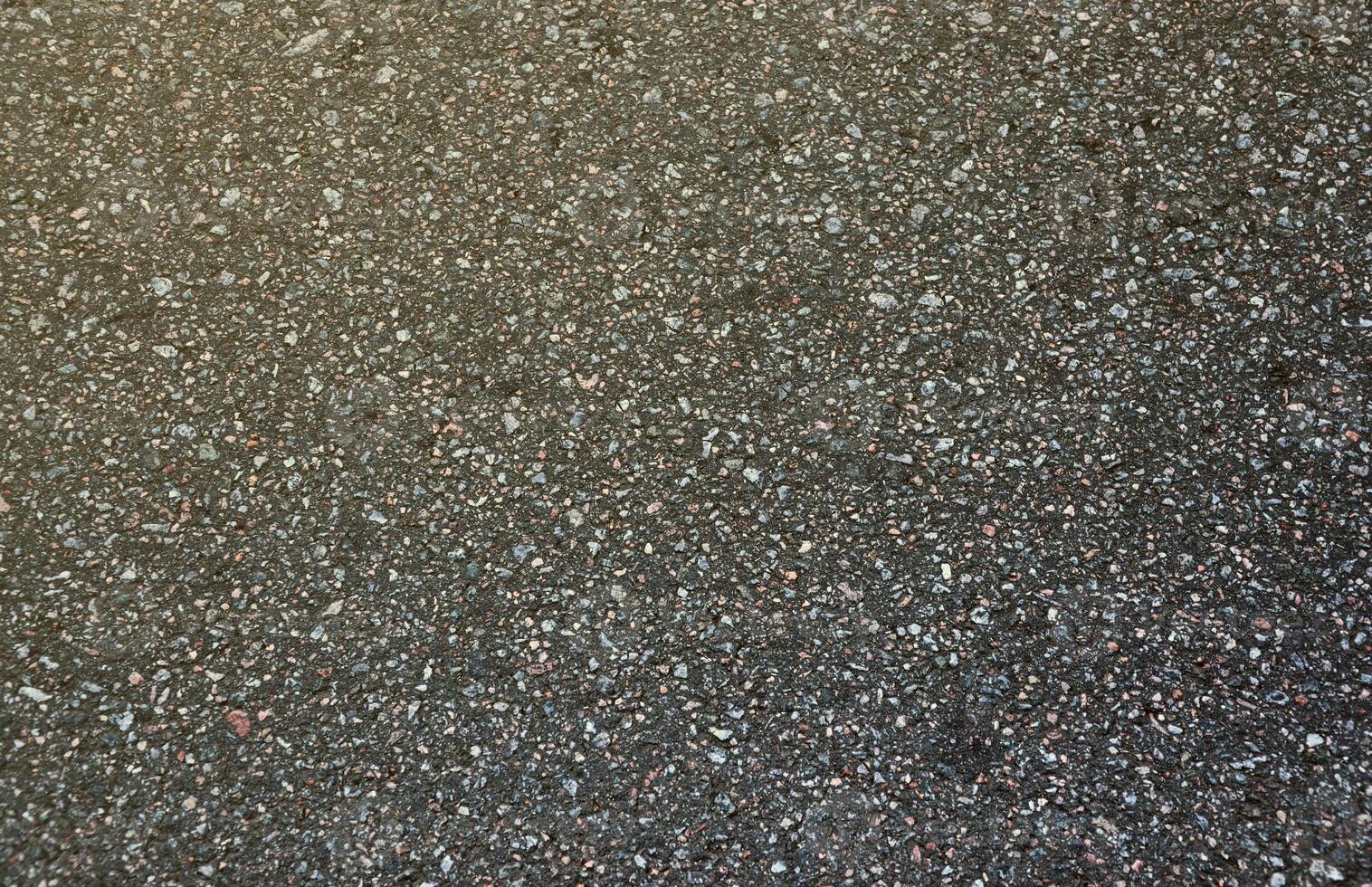 Surface grunge rough of asphalt. Tarmac dark grey grainy road. Texture Background Top view photo