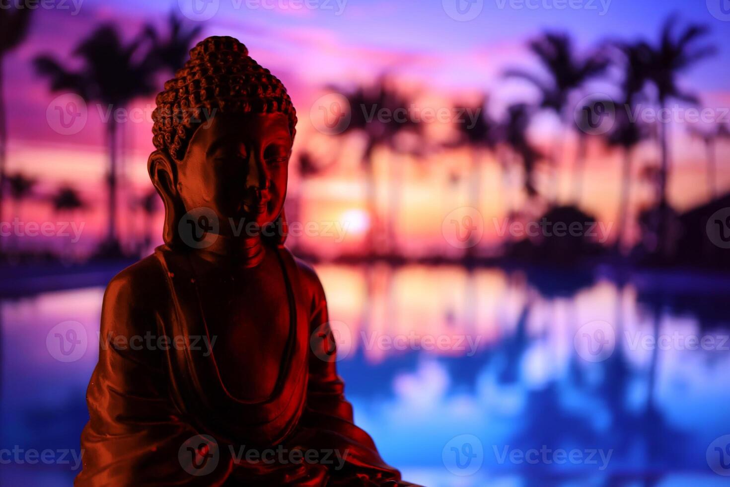 Buddha Purnima and Vesak day concept, Buddha statue with low key light against beautiful and colorful background. Meditation photo