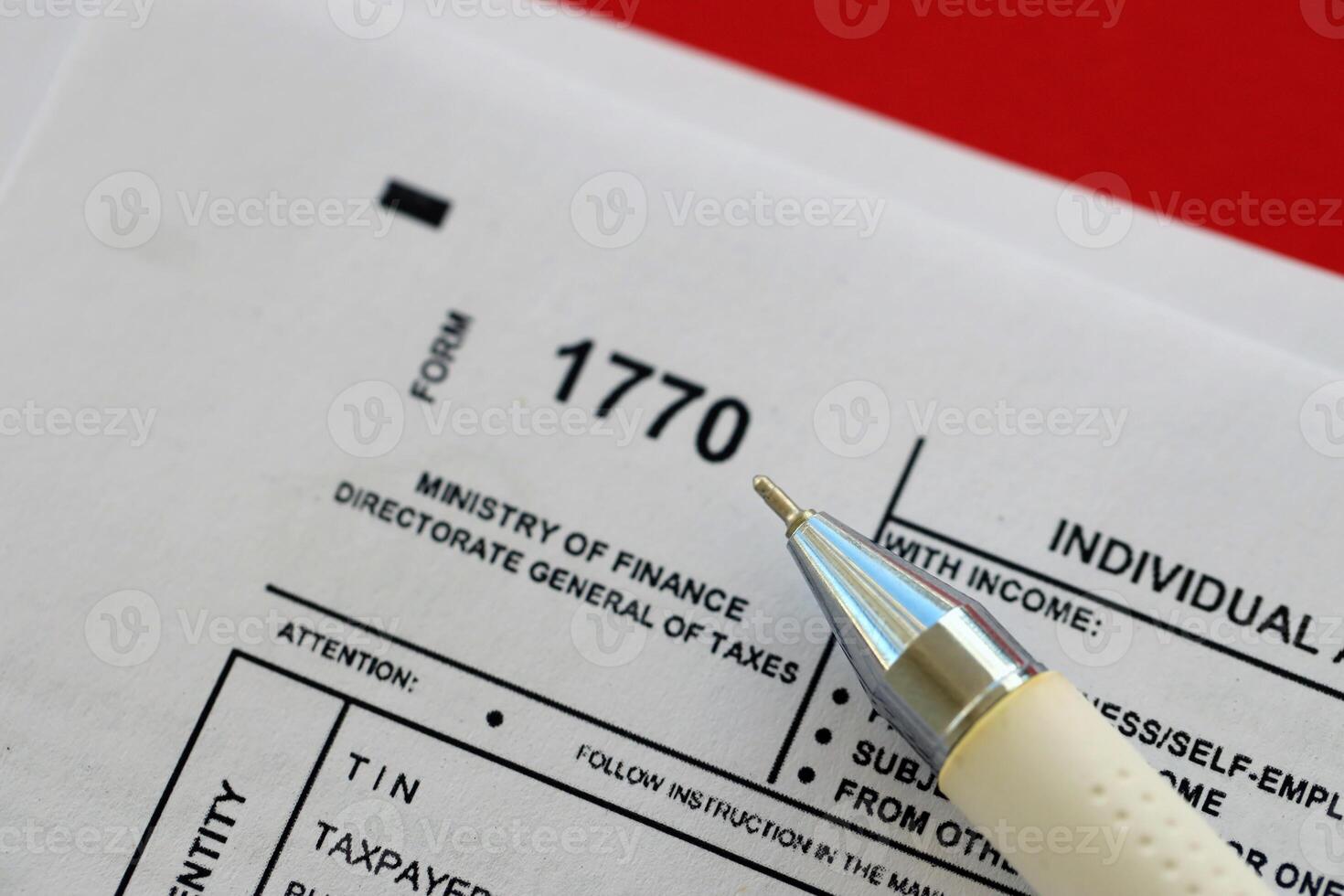 Indonesian tax form 1770 Individual Income Tax Return and pen on table photo