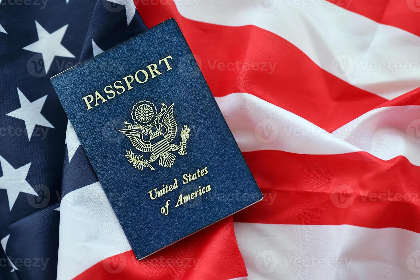 Blue United States of America passport on national flag background close up photo