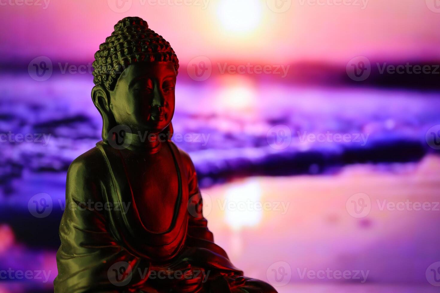 Buddha Purnima and Vesak day concept, Buddha statue with low key light against beautiful and colorful background. Meditation photo