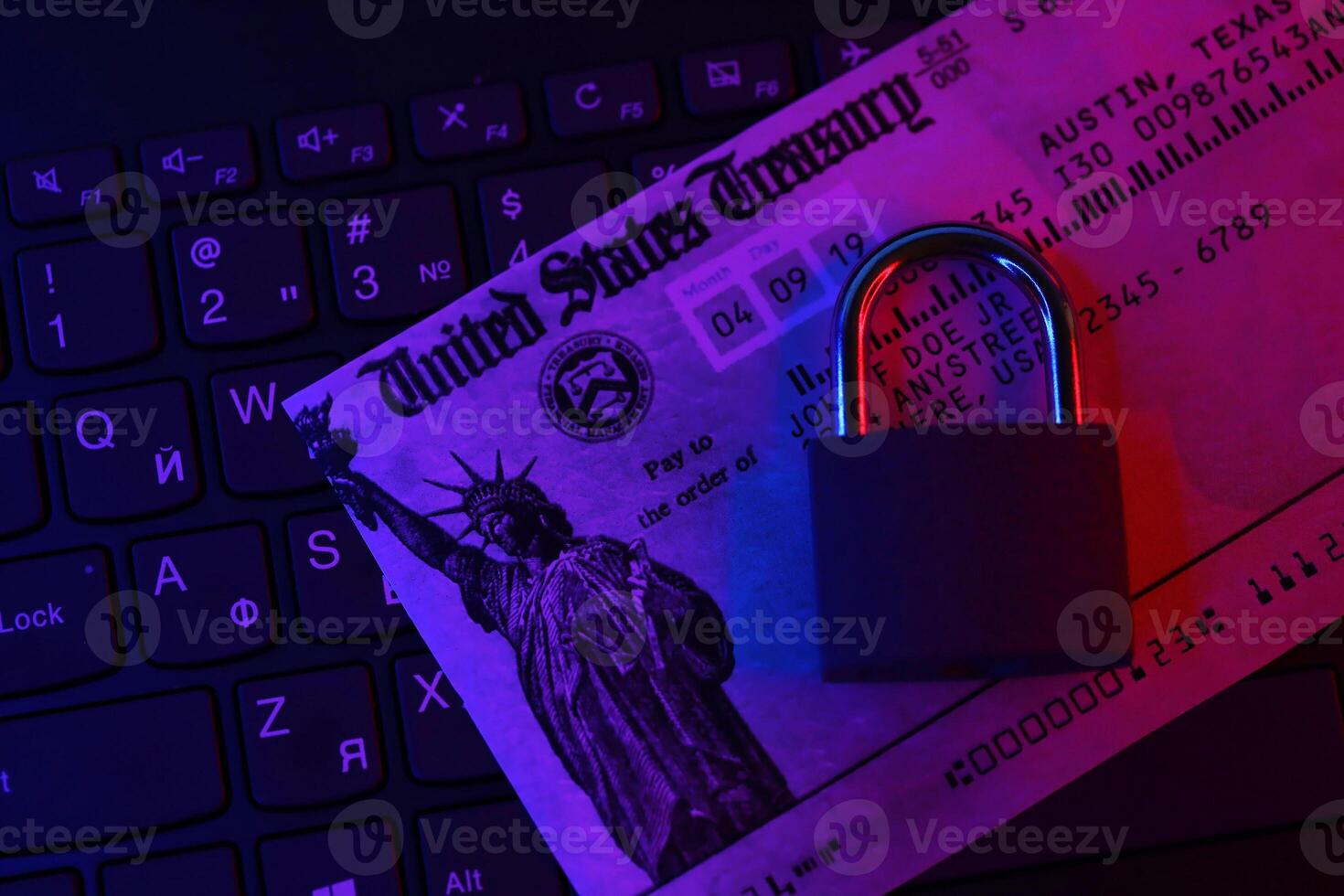 United States Treasury refund check or stimulus bill with small padlock on computer keyboard photo