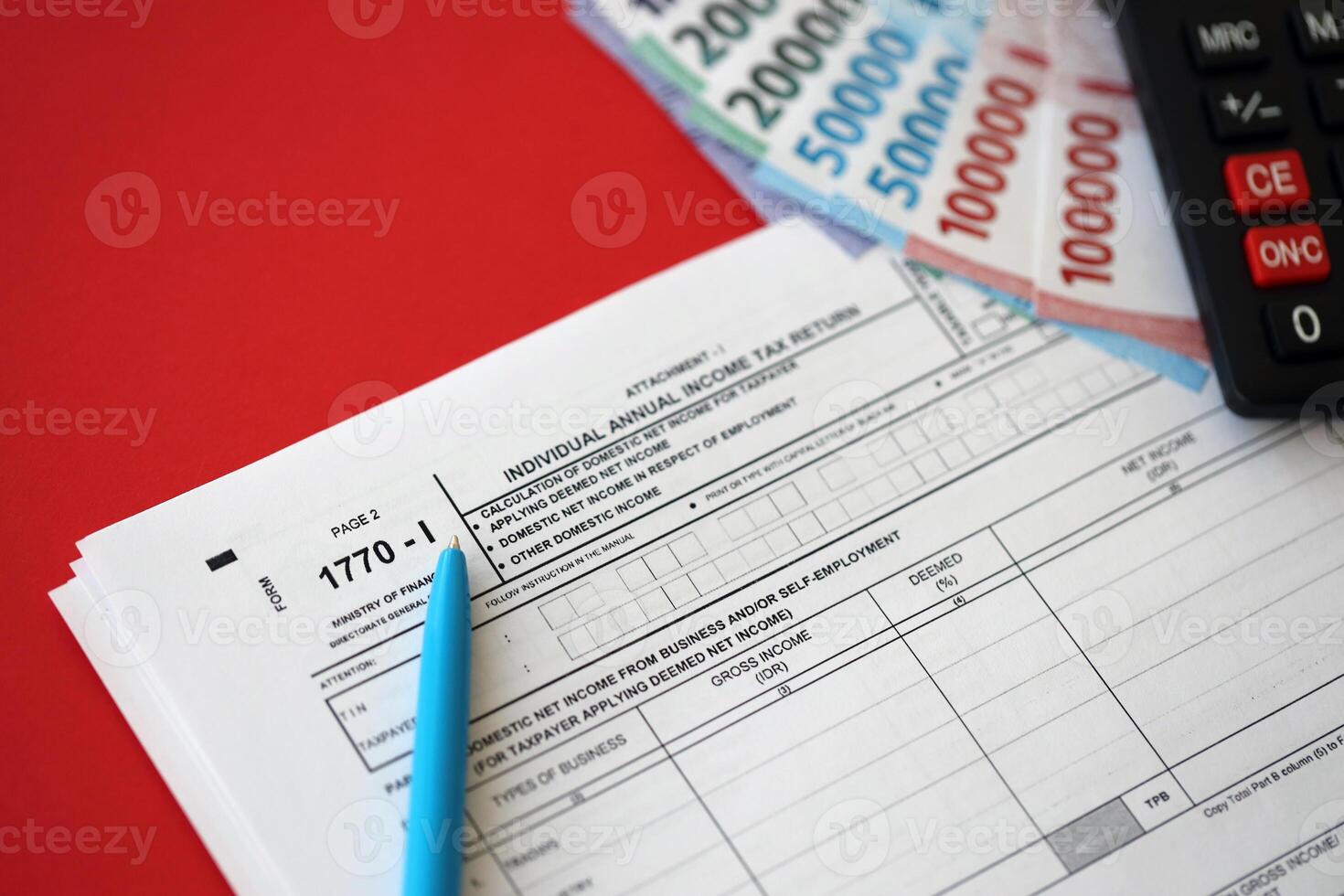 Indonesian tax form 1770-1 Individual Income Tax Return and pen on table photo