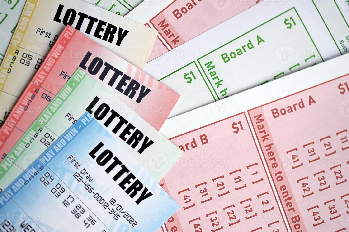 Lottery tickets of different colors on blank bills with numbers for playing lottery photo