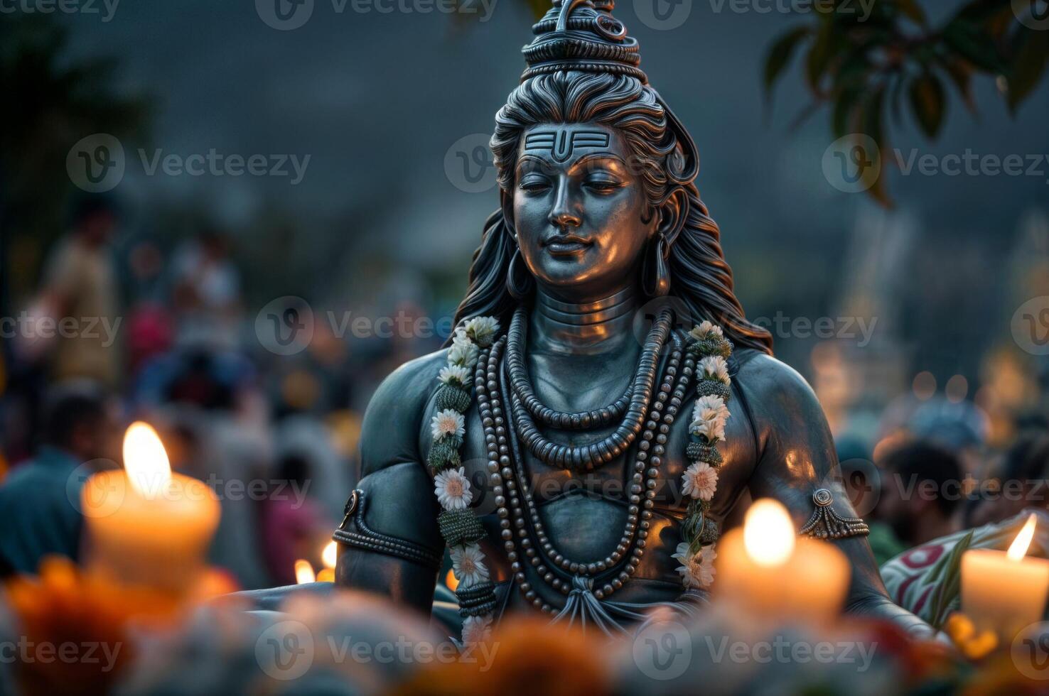 Shiva statue adorned with flowers and candles highlights Hinduism, deity worship and spirituality during a peaceful ceremony photo