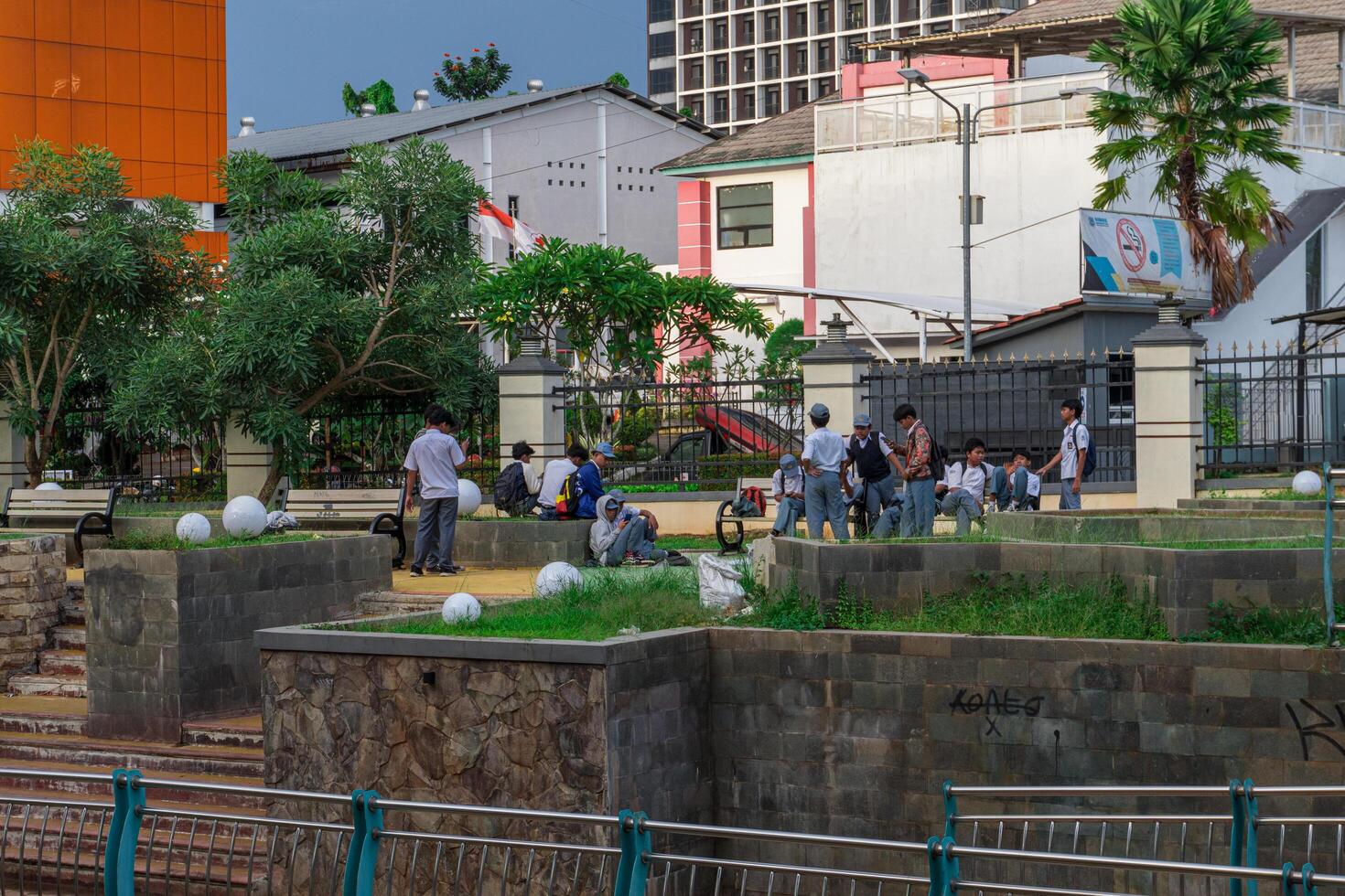 serpong south tangerang, march 4, 2024 - students gathered in the park beside the river. photo