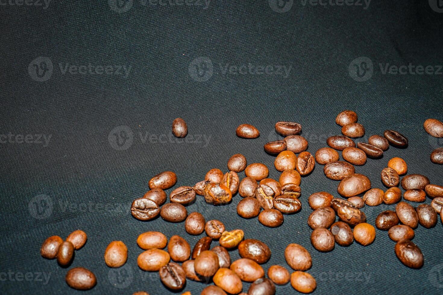 Close-up view of black coffee beans after roasting. photo