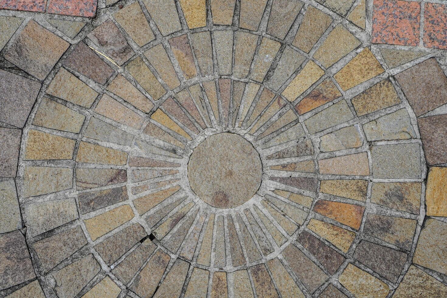 top view of the floor with natural stone neatly arranged with circular dots at the posts photo