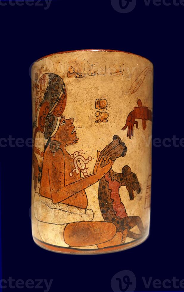 Late Classic AD 600 to 900 cylindrical polychrome jars with complex anthropomorphic, geometric, and glyph painted decoration. Polychrome pottery was an elaborate, advanced art form of the Maya. photo