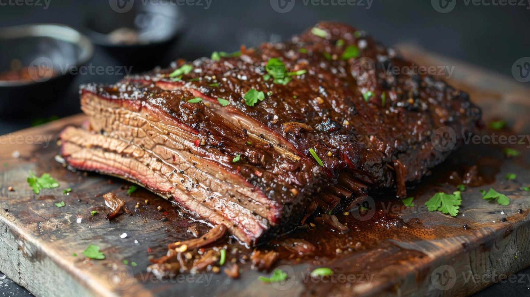 Succulent beef brisket barbecue with spices and parsley on wood board photo