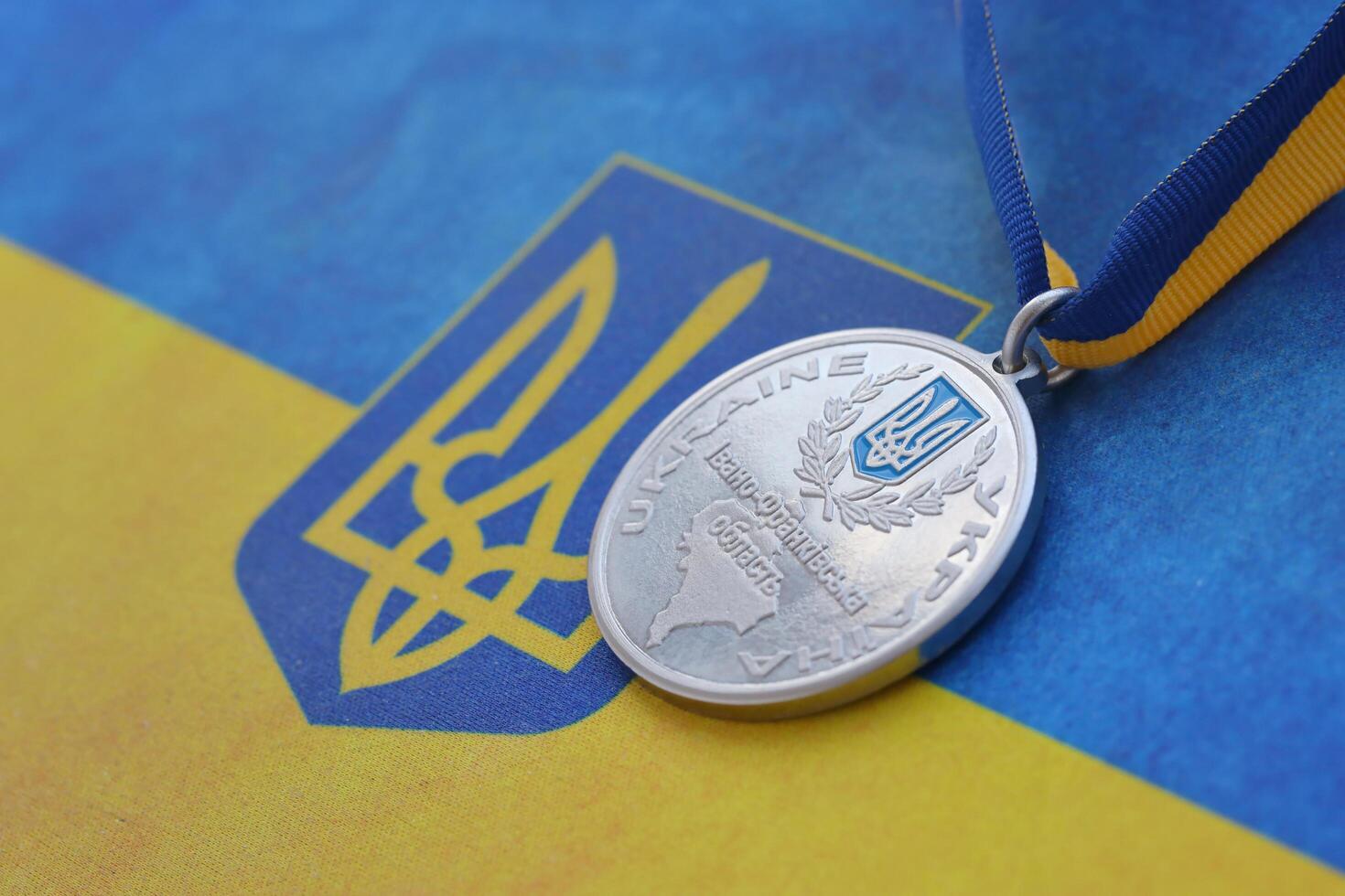 KYIV, UKRAINE - MAY 4, 2022 Medal for the person who conquered Mount Hoverla photo