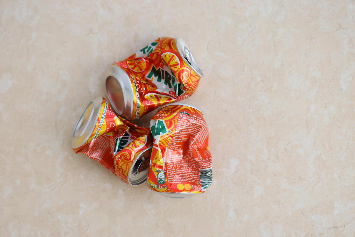 KYIV, UKRAINE - 4 MAY, 2023 Mirinda orange drink in orange citrus tin can with classic design and logo photo