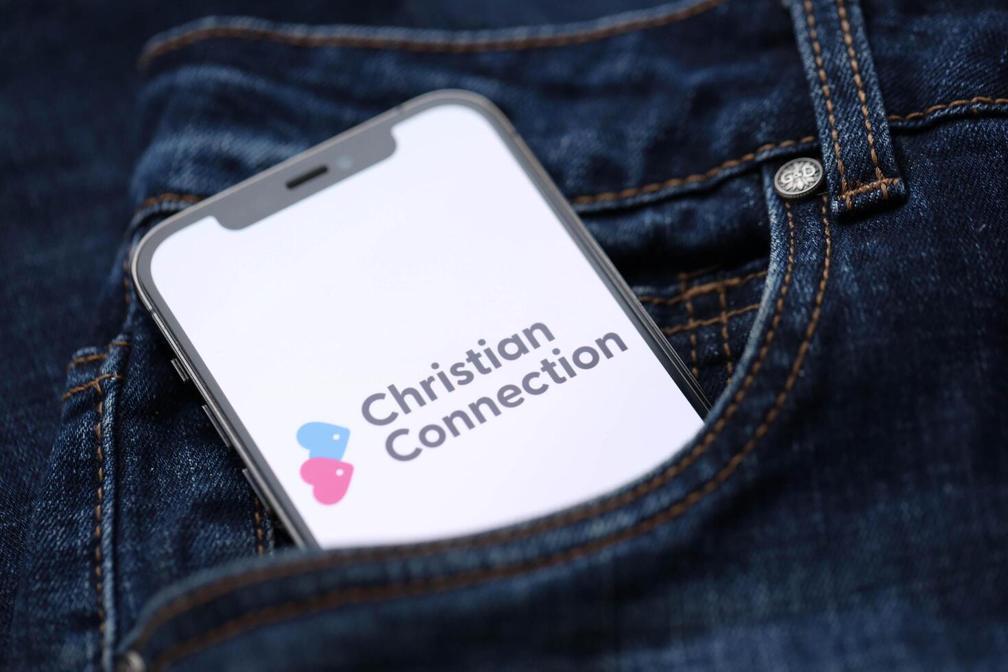 KYIV, UKRAINE - FEBRUARY 23, 2024 Christian Connection logo of famous dating website or app on iPhone display photo