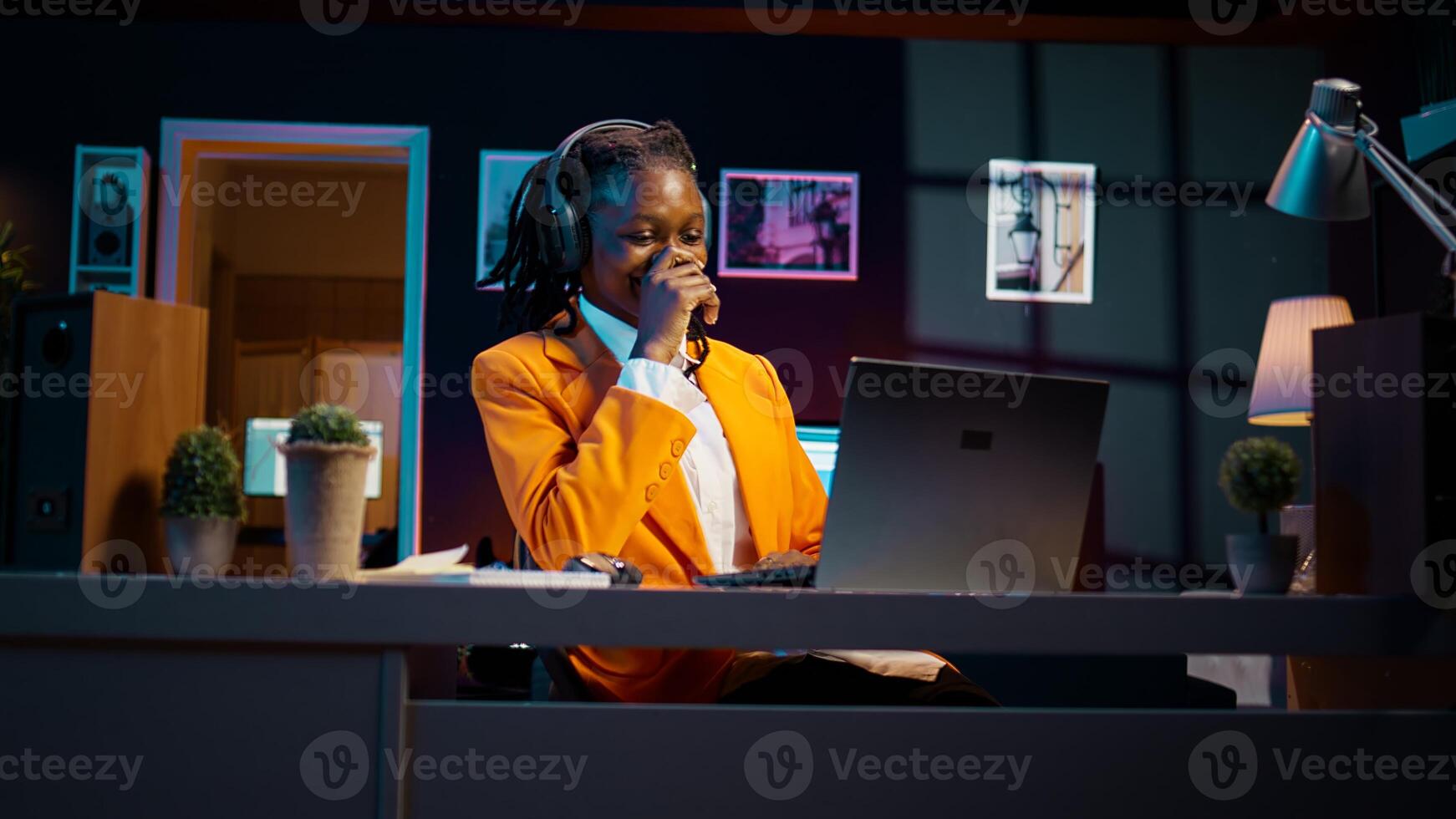 African american girl listening to professor debating latest lesson, taking notes after understanding explanations. Student participating at online school classes on academic platform. Camera B. photo