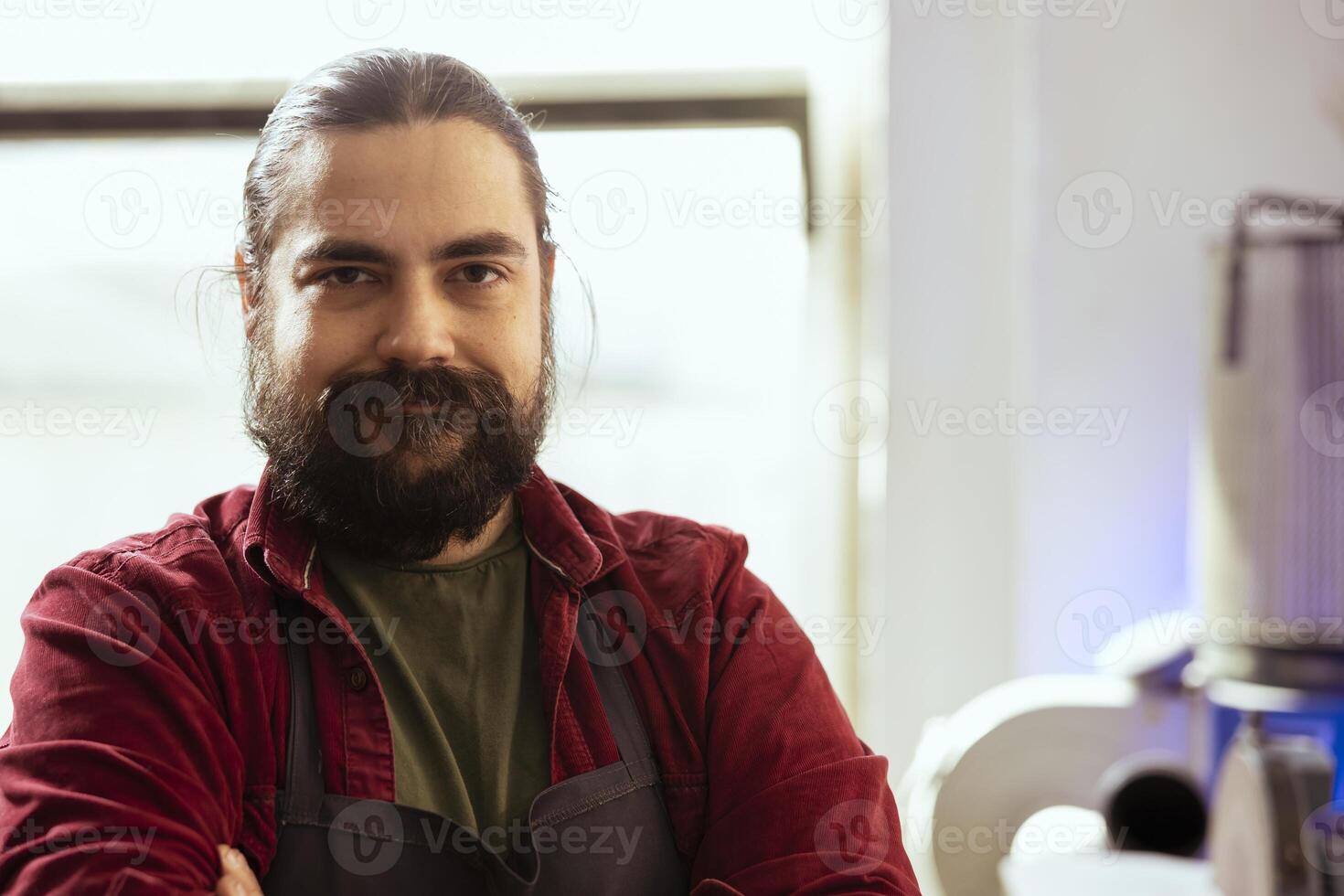 Portrait of smiling carpenter in woodworking shop proud of his work in furniture assembling business. Focus on upbeat cabinetmaker in joinery having crafting occupation, close up shot photo