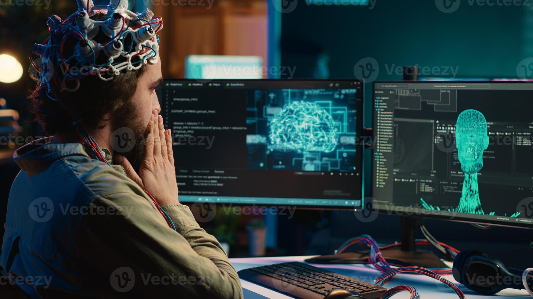IT technician using EEG headset stupefied after mind upload virtual process is successful. Man astounded after achieving goal of transferring consciousness into computer cyberspace, camera A photo