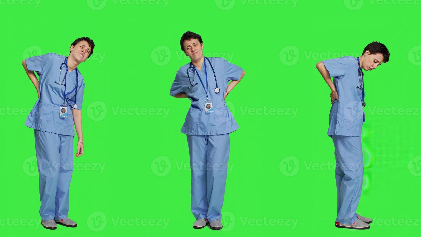 Health specialist suffering from lower back pain after working after hours, feeling in pain and overworked with night shifts. Nurse having spine discomfort from scoliosis and bad posture. Camera A. photo