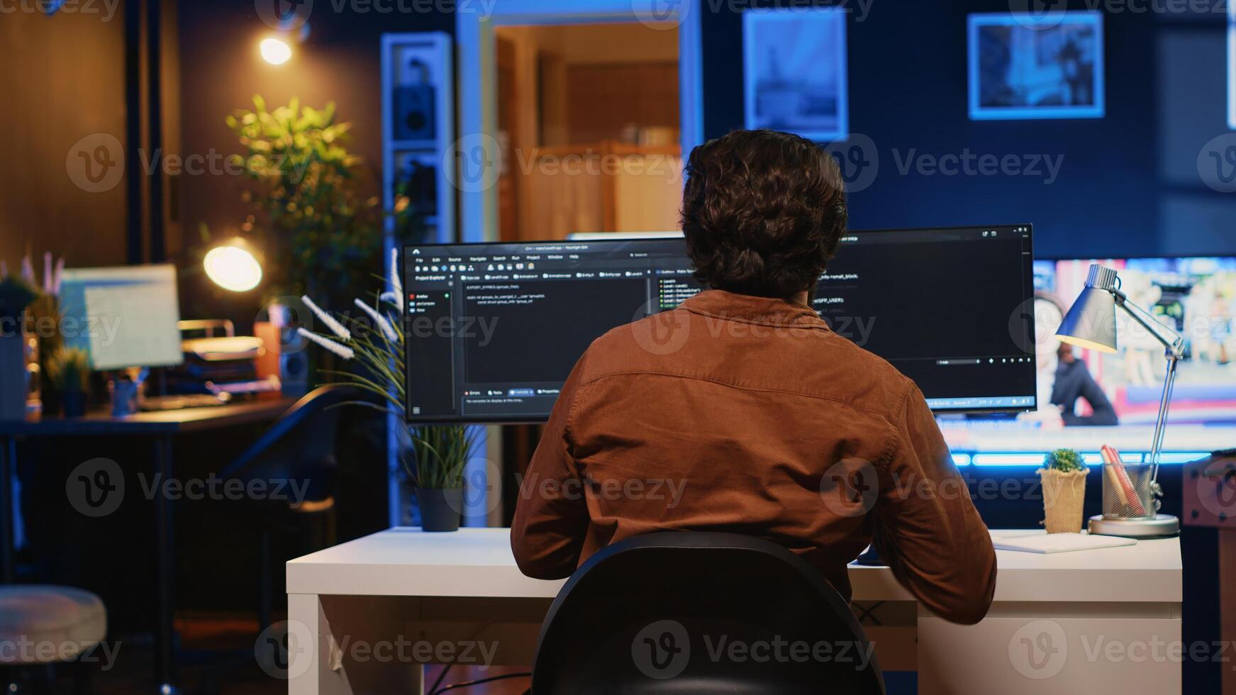 Developer arriving in apartment office with coffee mug in hand, ready to start coding on computer. IT specialist begins teleworking job shift, holding cup of tea, upgrading company software, camera A photo