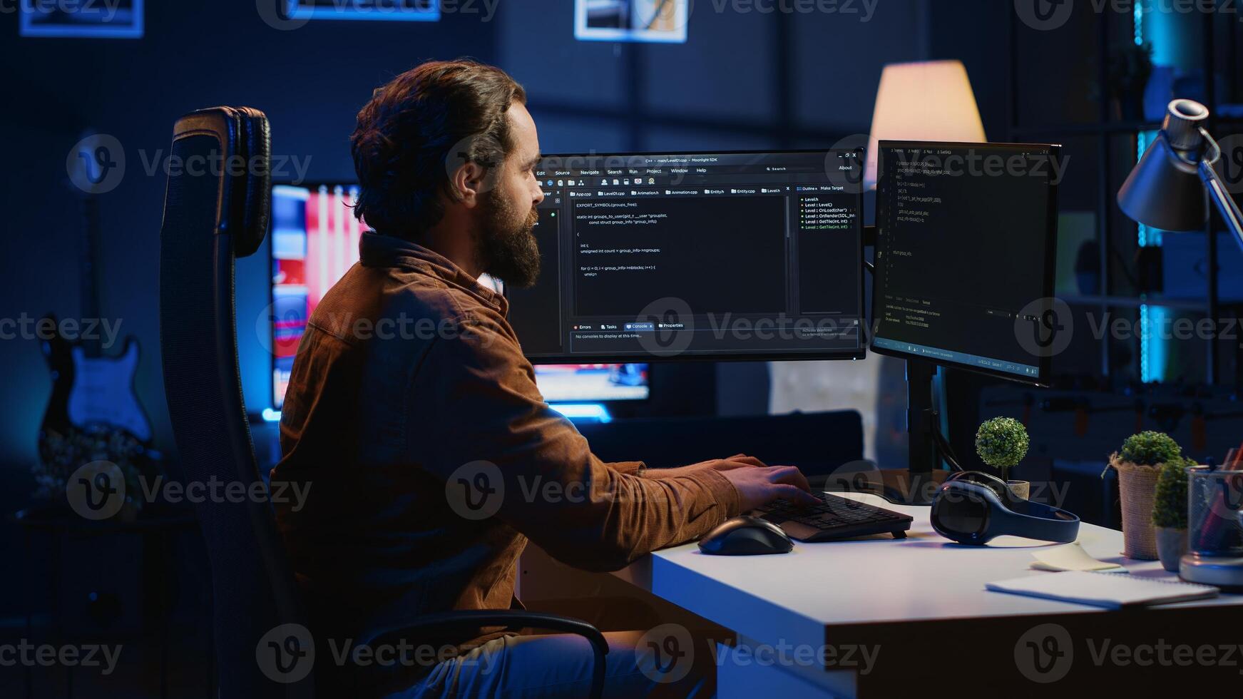 Programmer developing code on computer screen while in personal office using java programming languages. IT admin working with software tool, fixing database errors while working from home, camera A photo