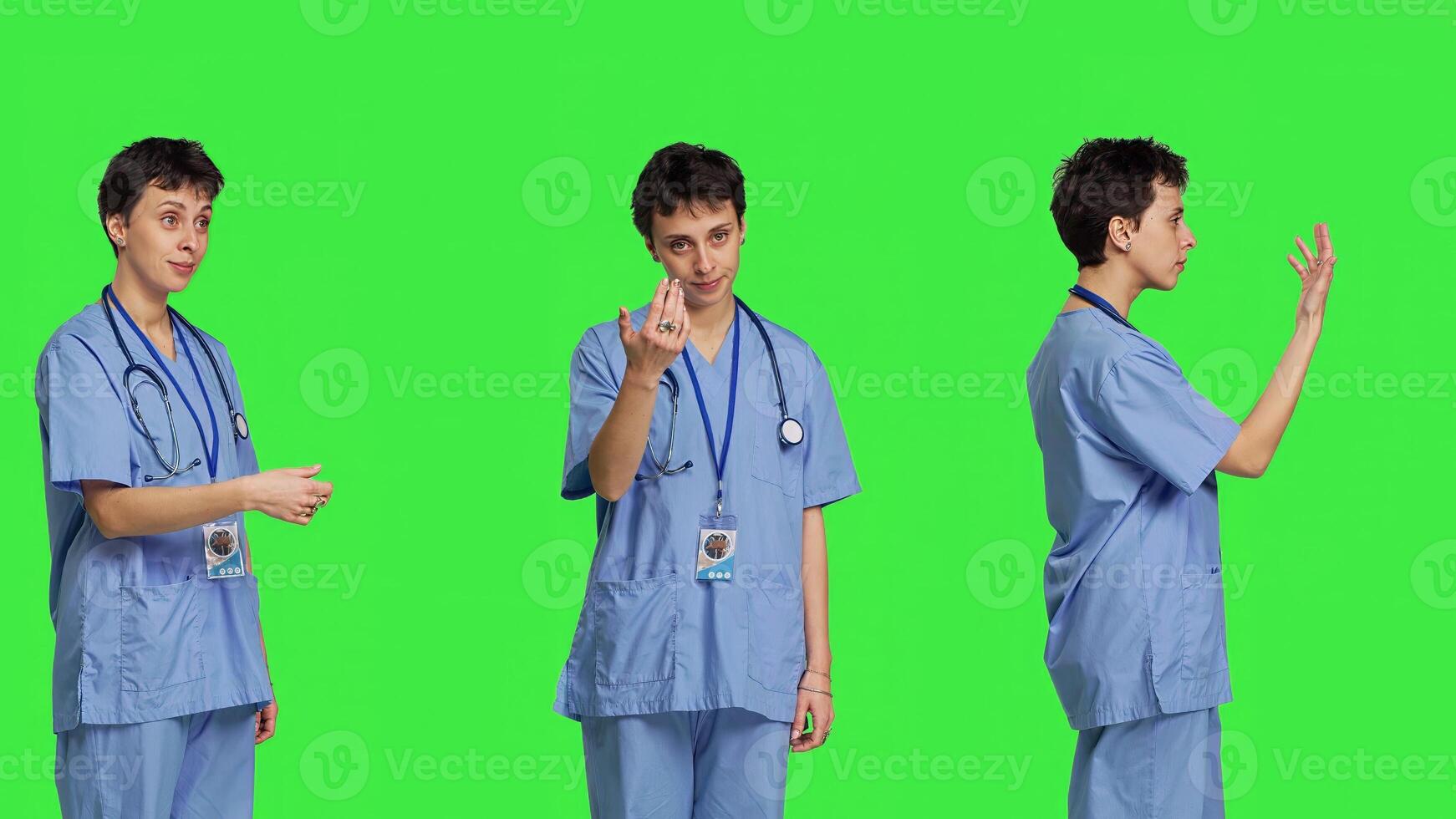 Medical assistant asking a person to come over closer against greenscreen backdrop, inviting patient to approach. Nurse in scrubs calling someone at checkup examination, young surgeon. Camera B. photo