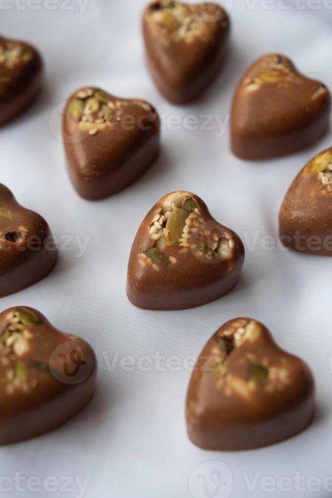 Handmade Heart-Shaped Chocolates with grains photo