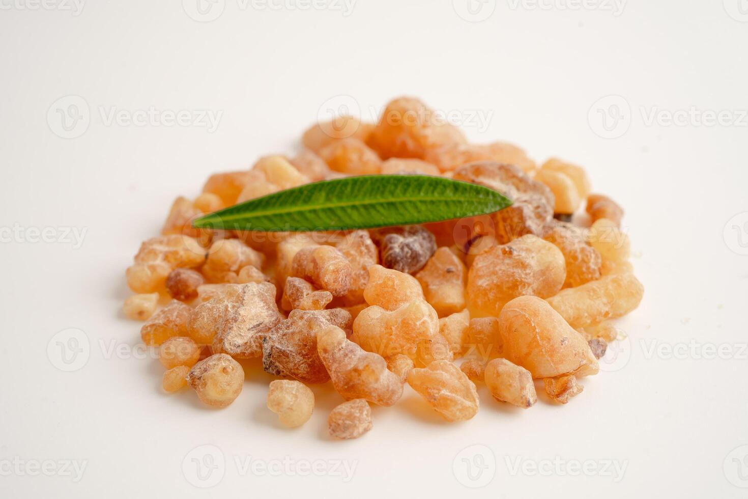 Frankincense or olibanum aromatic resin isolated on white background used in incense and perfumes. photo