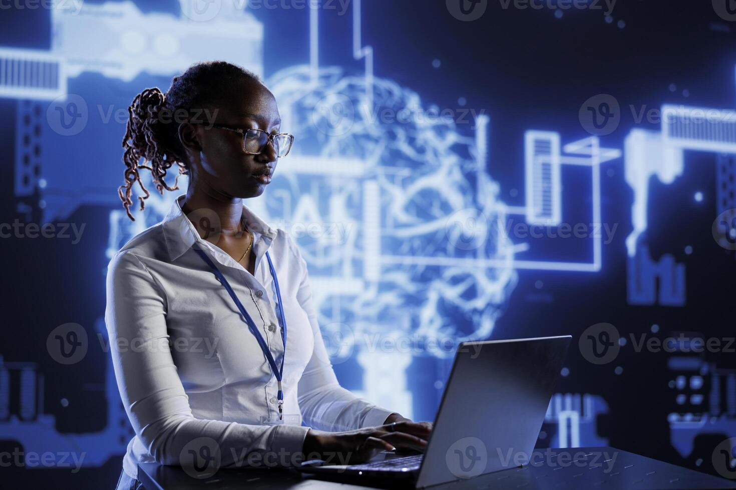 BIPOC woman developing artificial intelligence neural networks architecture inspired by human brain. Tech support setting up AI machine learning algorithms in high tech startup photo