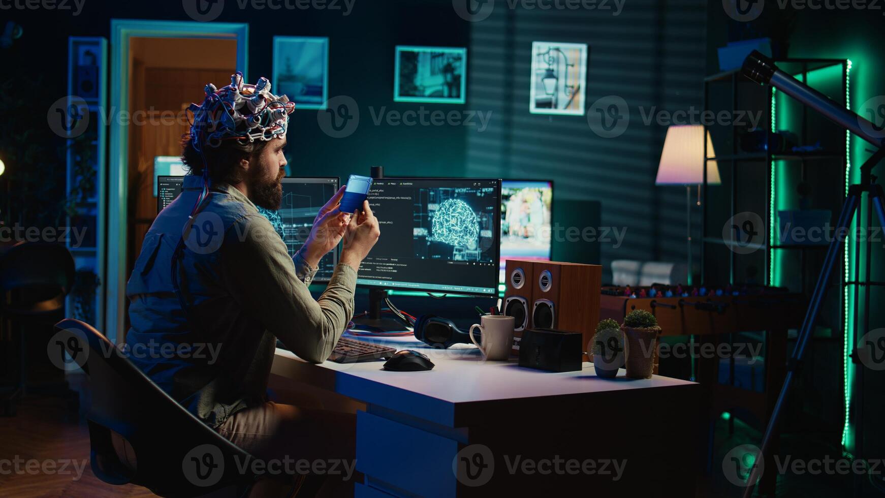 IT specialist using EEG headset and deep learning technology to upload brain into computer. Close up of neuroscientific equipment used by man transferring consciousness into cyberspace, camera B photo