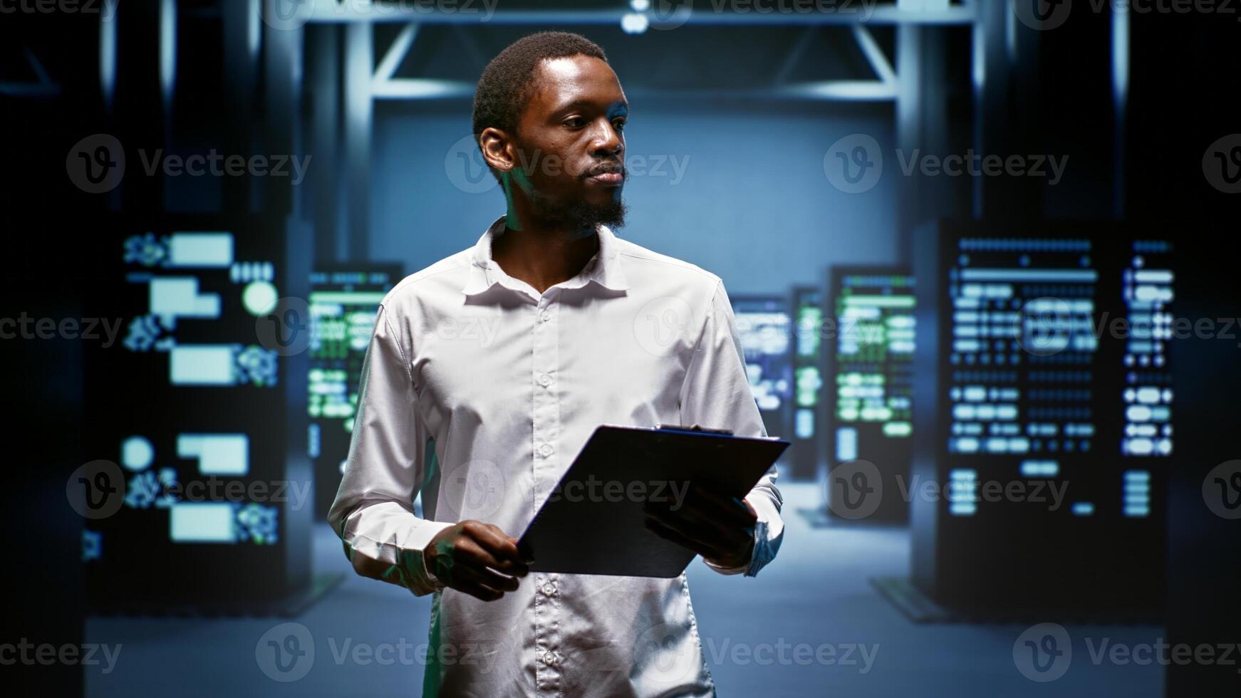 African american engineer doing maintenance in data center providing vast computing resources and storage, enabling artificial intelligence to process massive datasets for training and inference photo