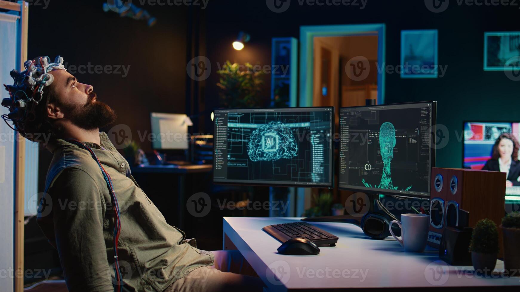 Programmer using EEG headset to upload his mind into computer, attaining immortality. Neuroscientist experimenting with transferring consciousness into cyberspace, camera B photo